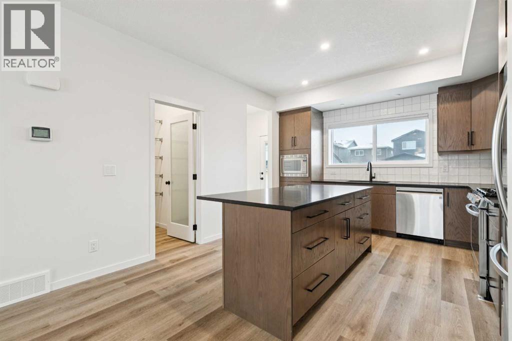 Single Family House for Sale in  Belmont Villas SW Belmont Calgary 