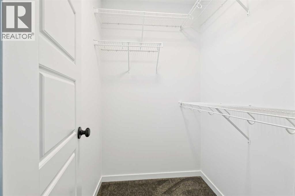 Single Family House for Sale in  Belmont Villas SW Belmont Calgary 