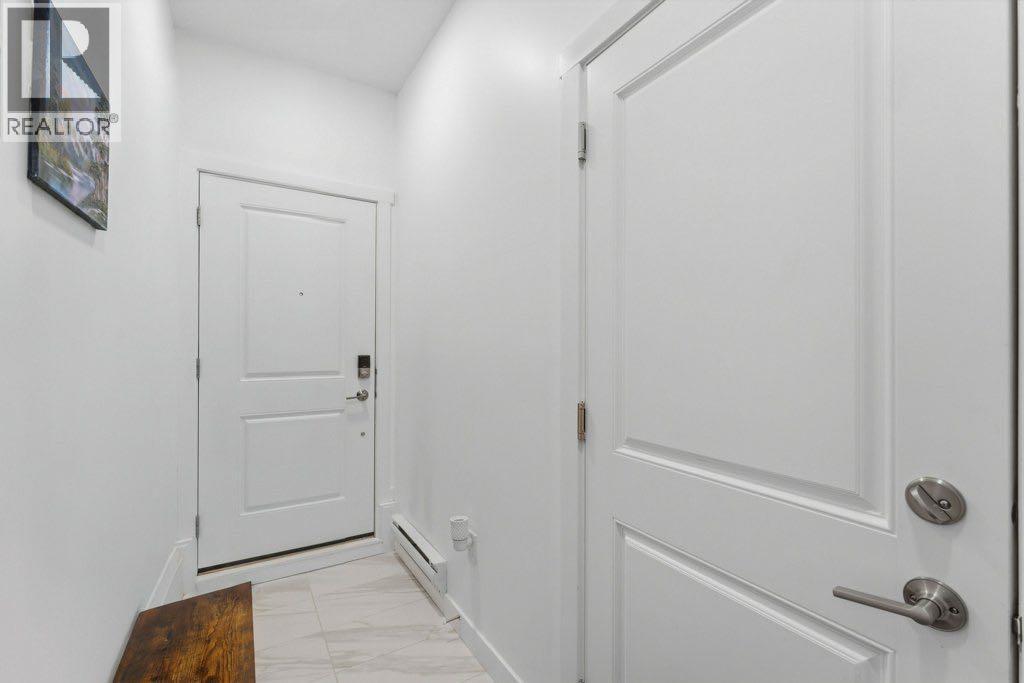 804, 33 Merganser Drive W - Photo 3 of 32, Chestermere, Alberta