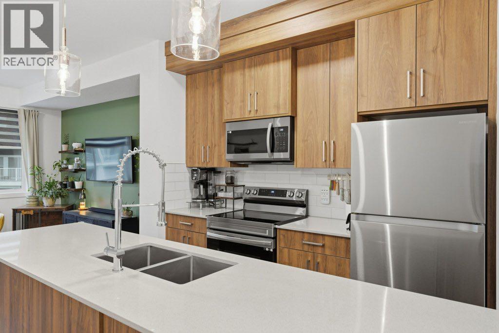 804, 33 Merganser Drive W - Photo 5 of 32, Chestermere, Alberta