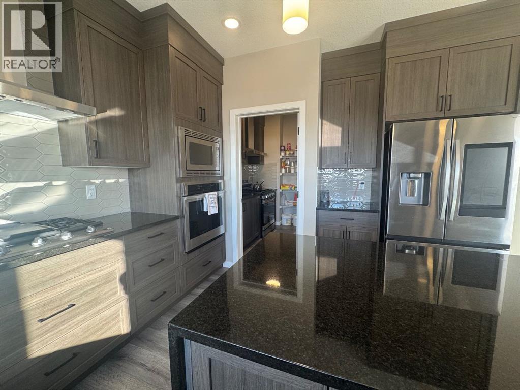 Single Family House for Sale in  Lucas Gardens NW Livingston Calgary 