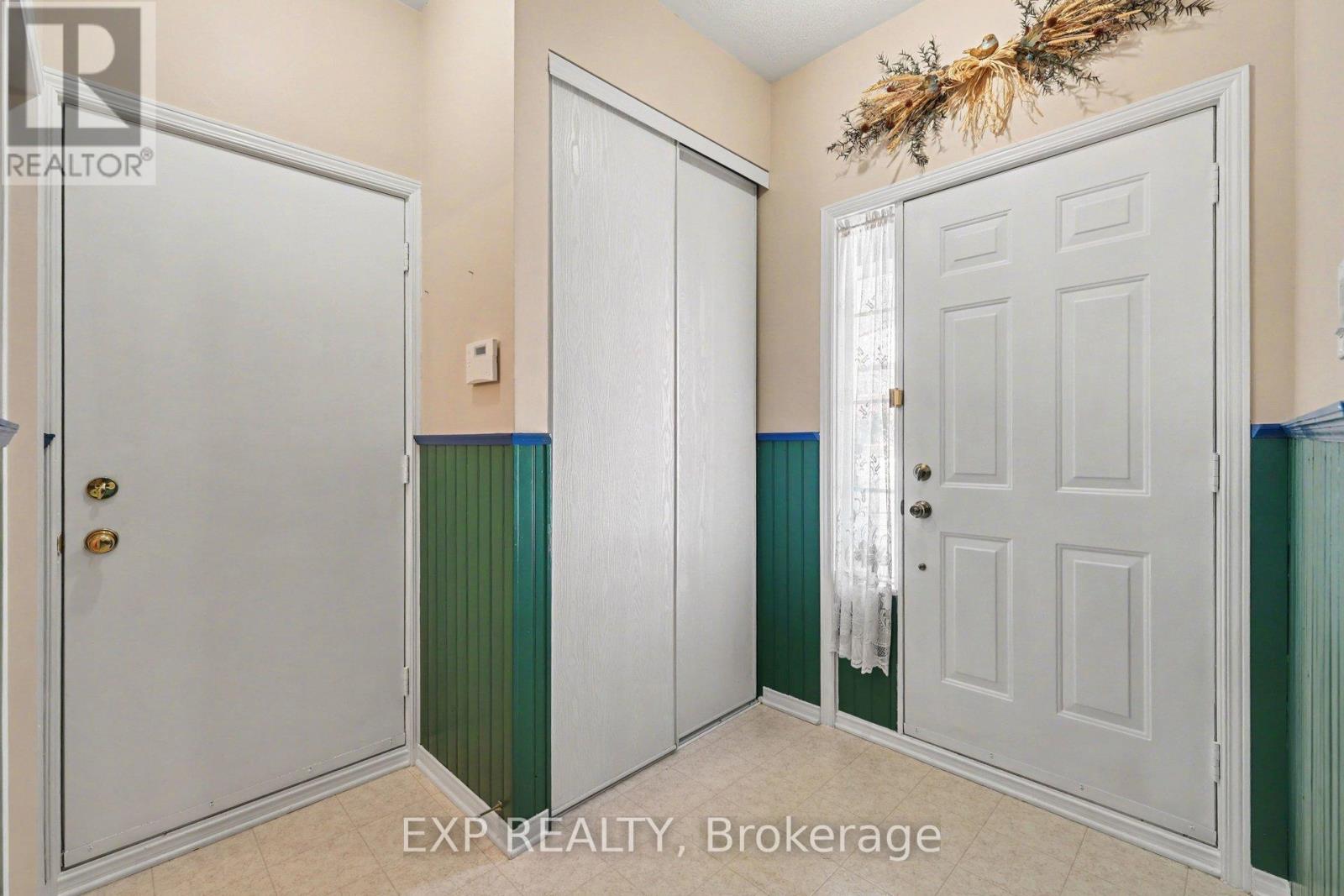 Spacious foyer with access the garage.