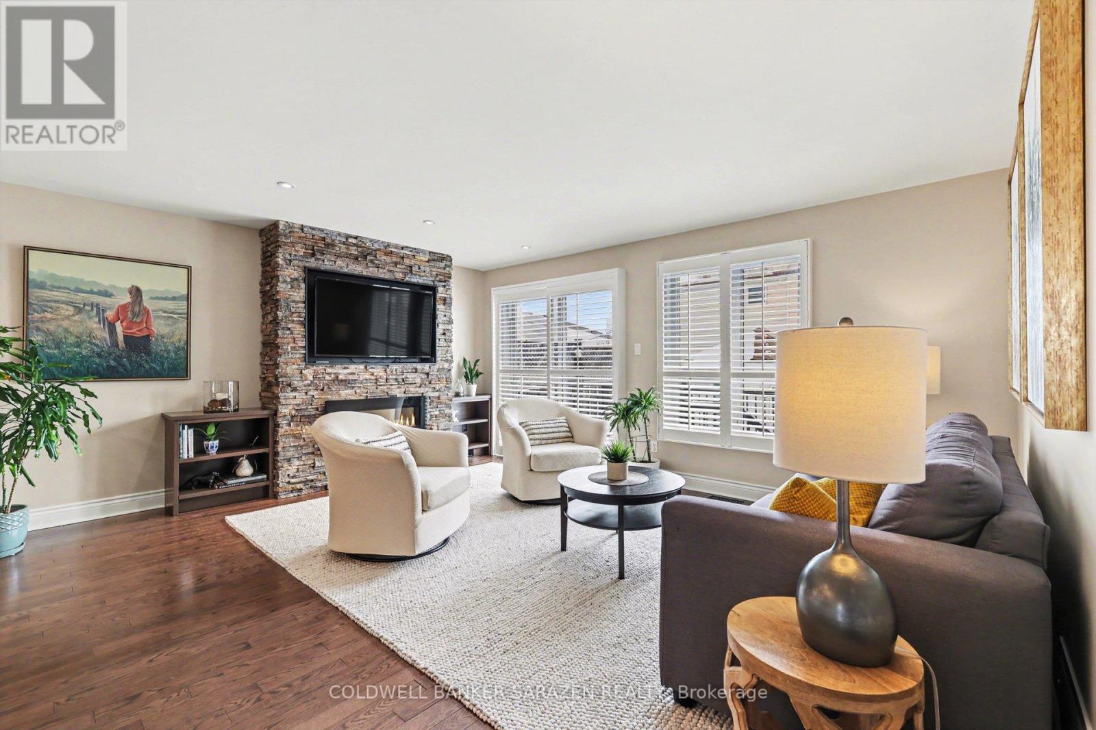 Built in shelving surrounding an electic fireplace