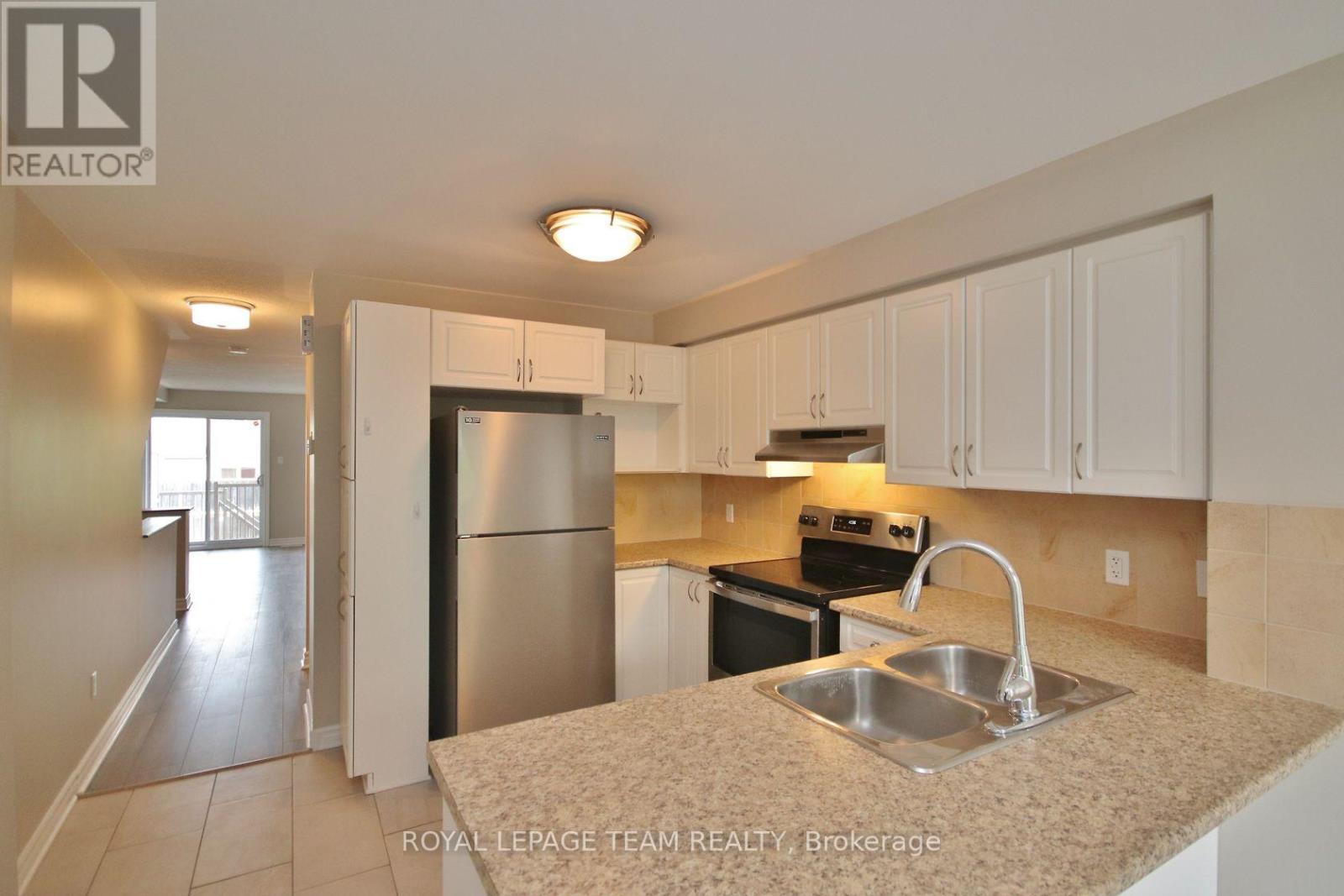Kitchen with stainless steel appliances.