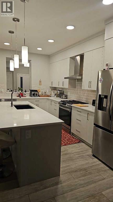 Single Family House for Sale in  Lucas Close NW Livingston Calgary 