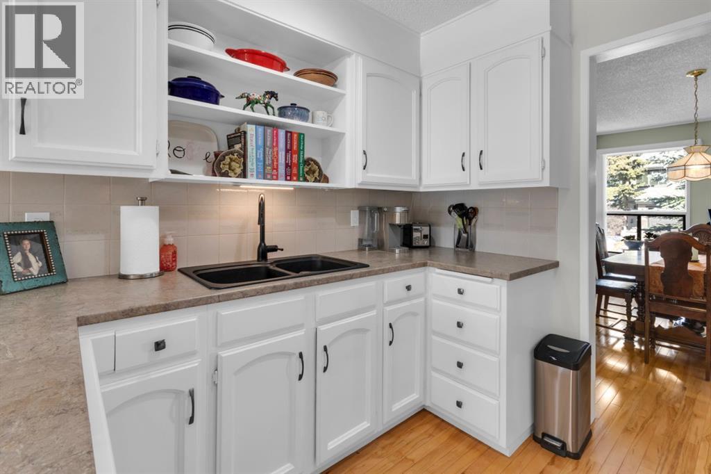 Single Family House Bi-level for Sale in  Coach Manor Rise SW Coach Hill Calgary 