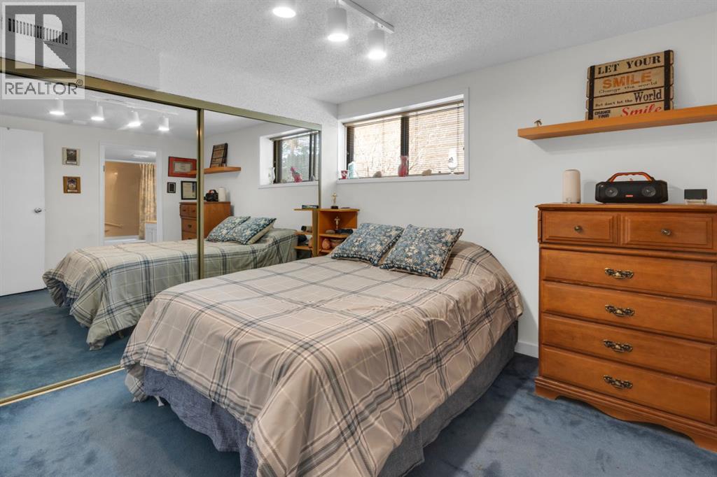 Single Family House Bi-level for Sale in  Coach Manor Rise SW Coach Hill Calgary 