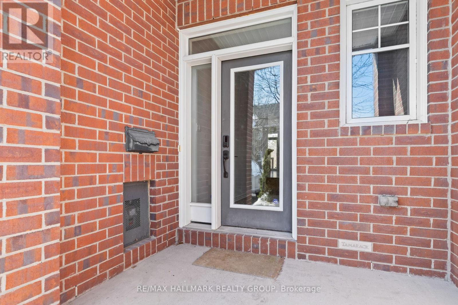 Front porch entrance with brick exterior