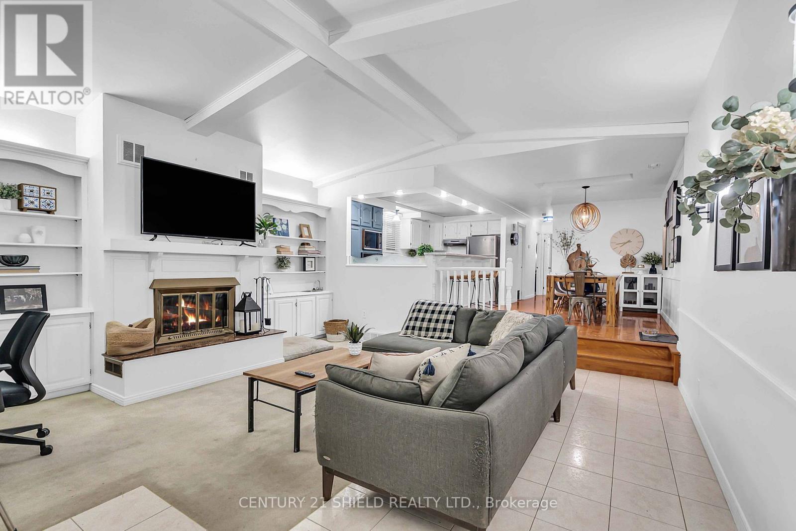 living room with wood burning fireplace