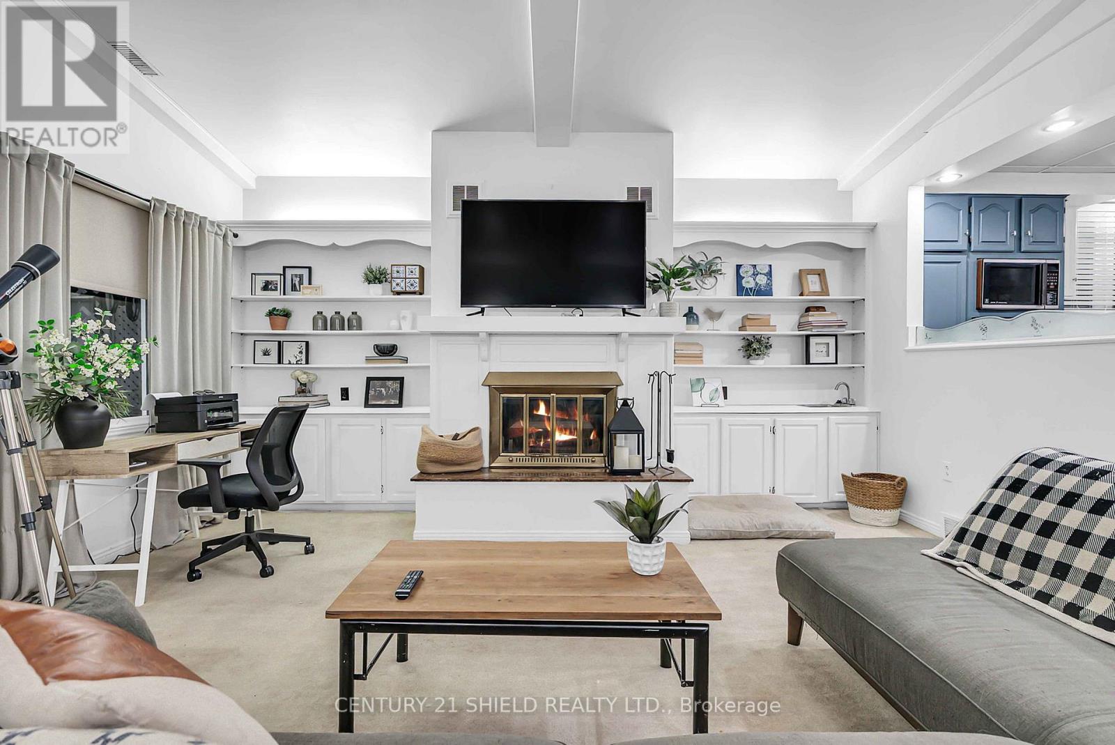 living room with wood burning fireplace