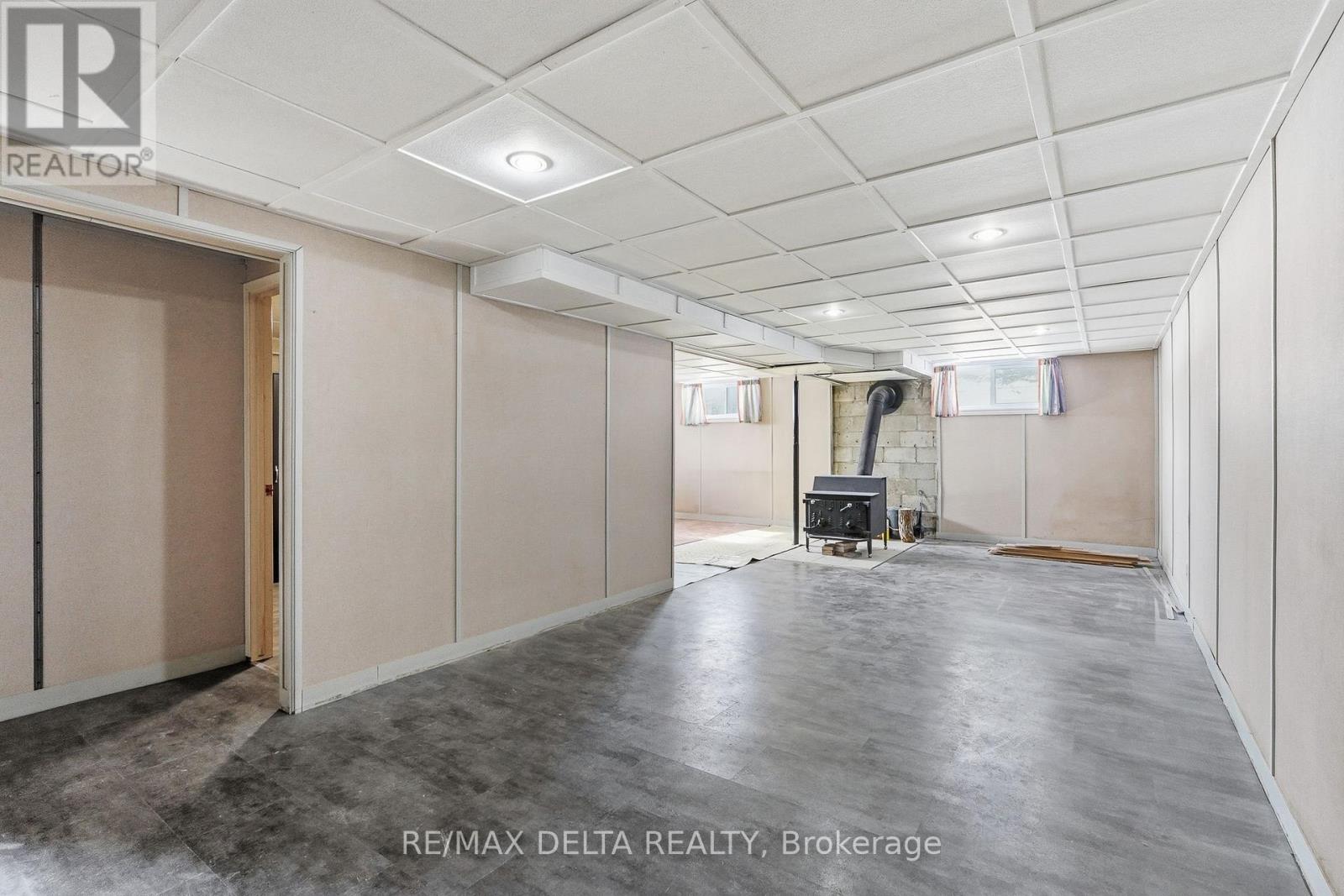 Inside entry to wide garage & stairs to lower lvl.
