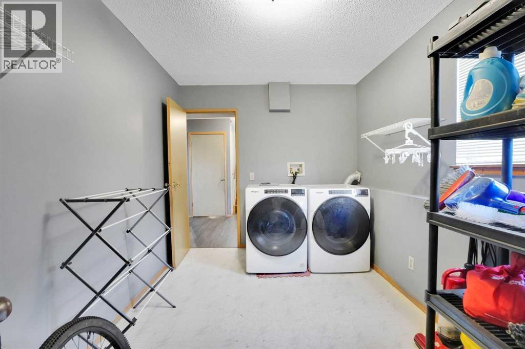 Single Family House 4 Level for Sale in  Laguna Way NE Monterey Park Calgary 