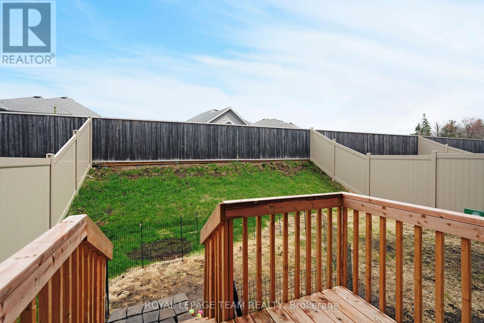 Back Yard with green grace and durable fence