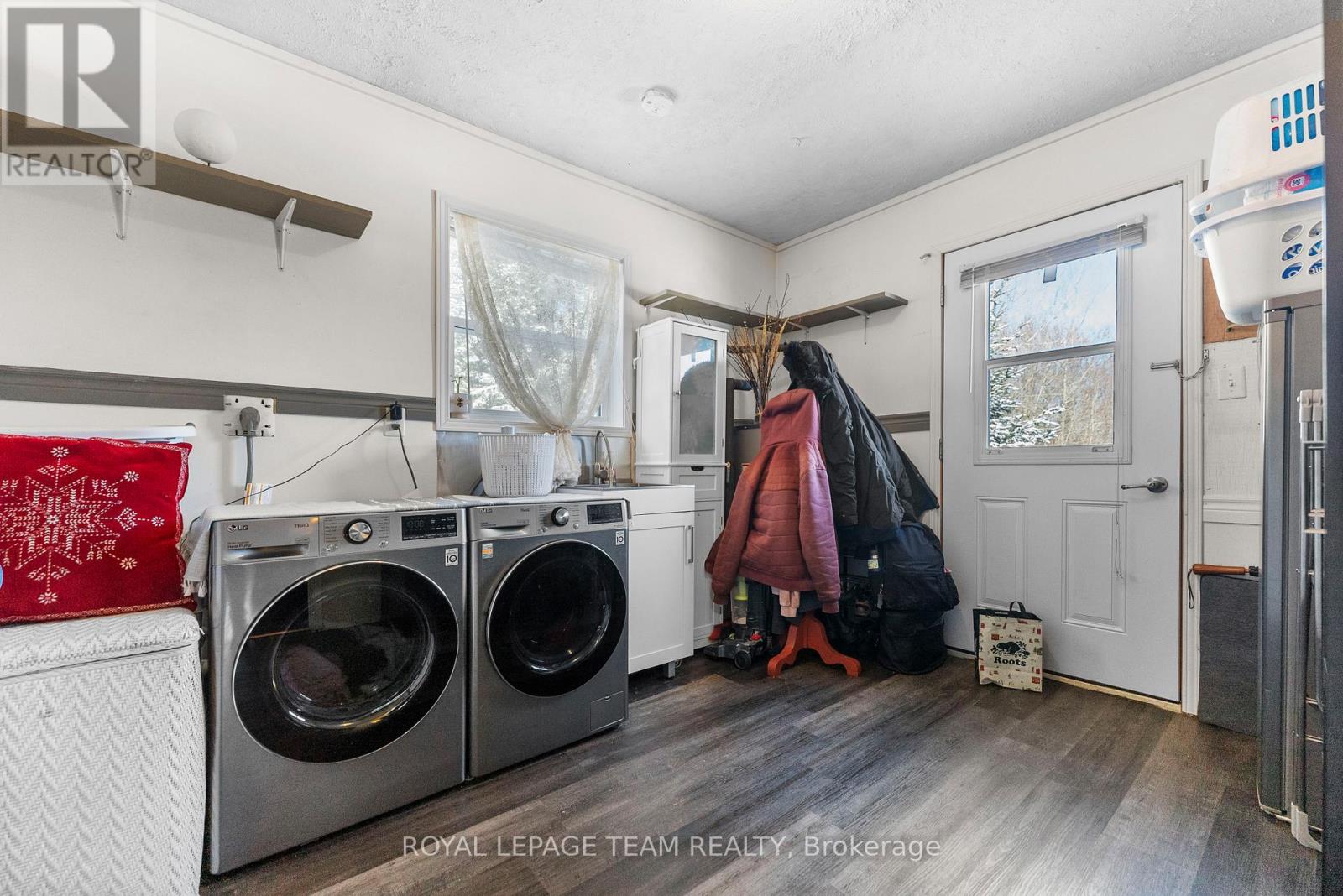 The laundry room is located at the rear of the hom