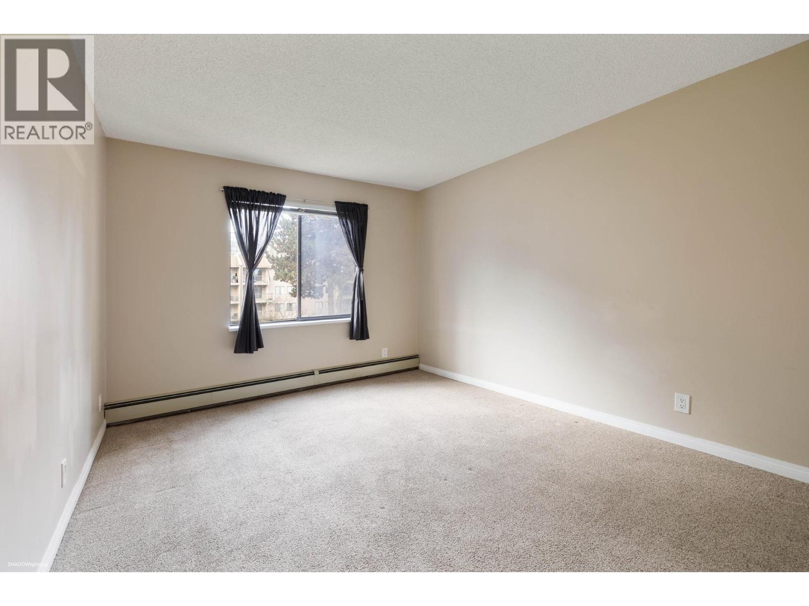 #210-8511 ACKROYD Road, Richmond