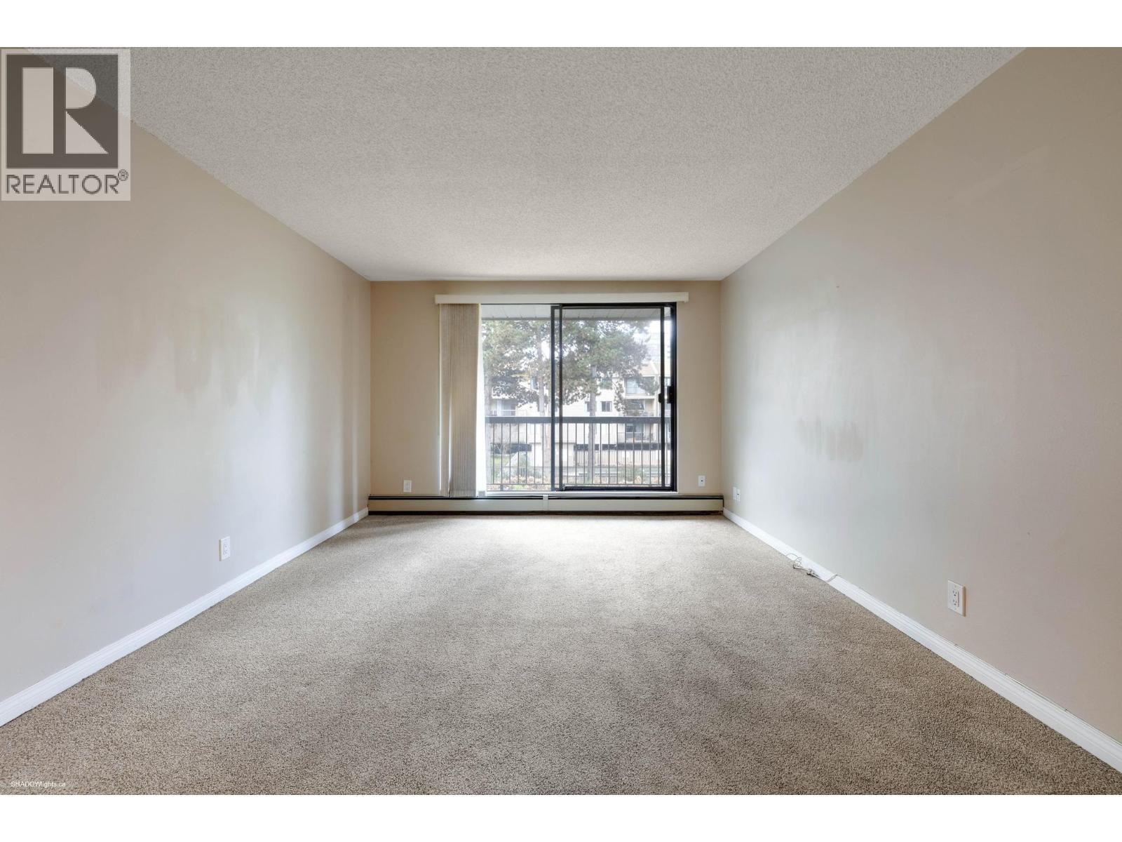 #210-8511 ACKROYD Road, Richmond