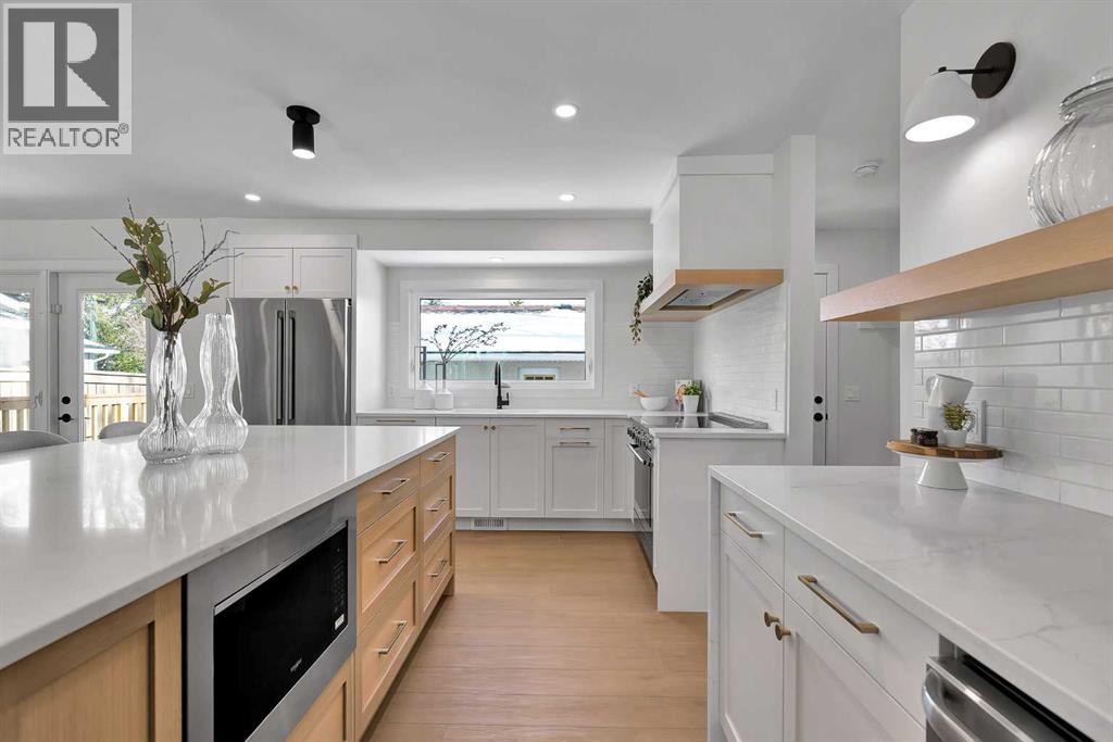 Single Family House 4 Level for Sale in  Lake Twintree Crescent SE Lake Bonavista Calgary 