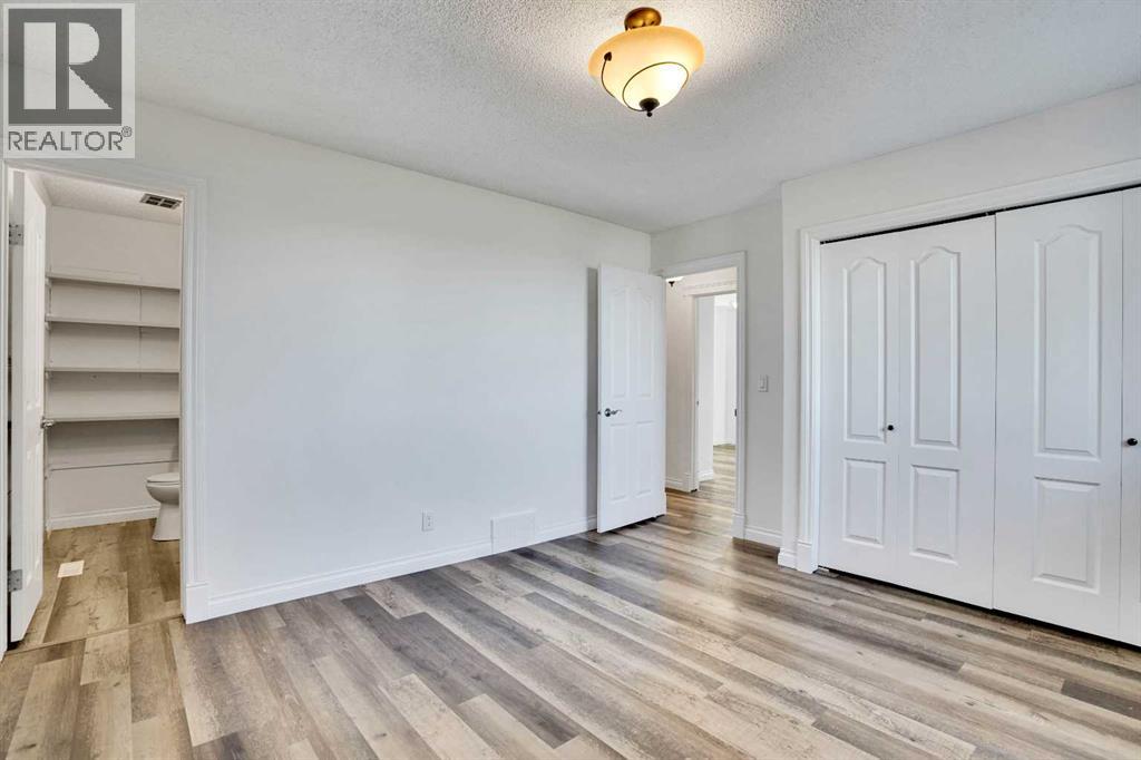 Single Family House 4 Level for Sale in  Coach Manor Rise SW Coach Hill Calgary 