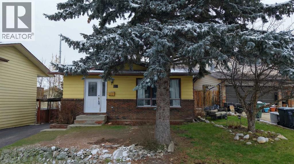 Single Family House 4 Level for Sale in  Coach Manor Rise SW Coach Hill Calgary 