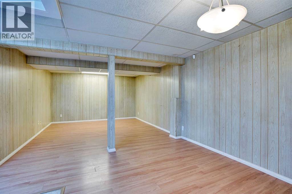 Single Family House 4 Level for Sale in  Coach Manor Rise SW Coach Hill Calgary 