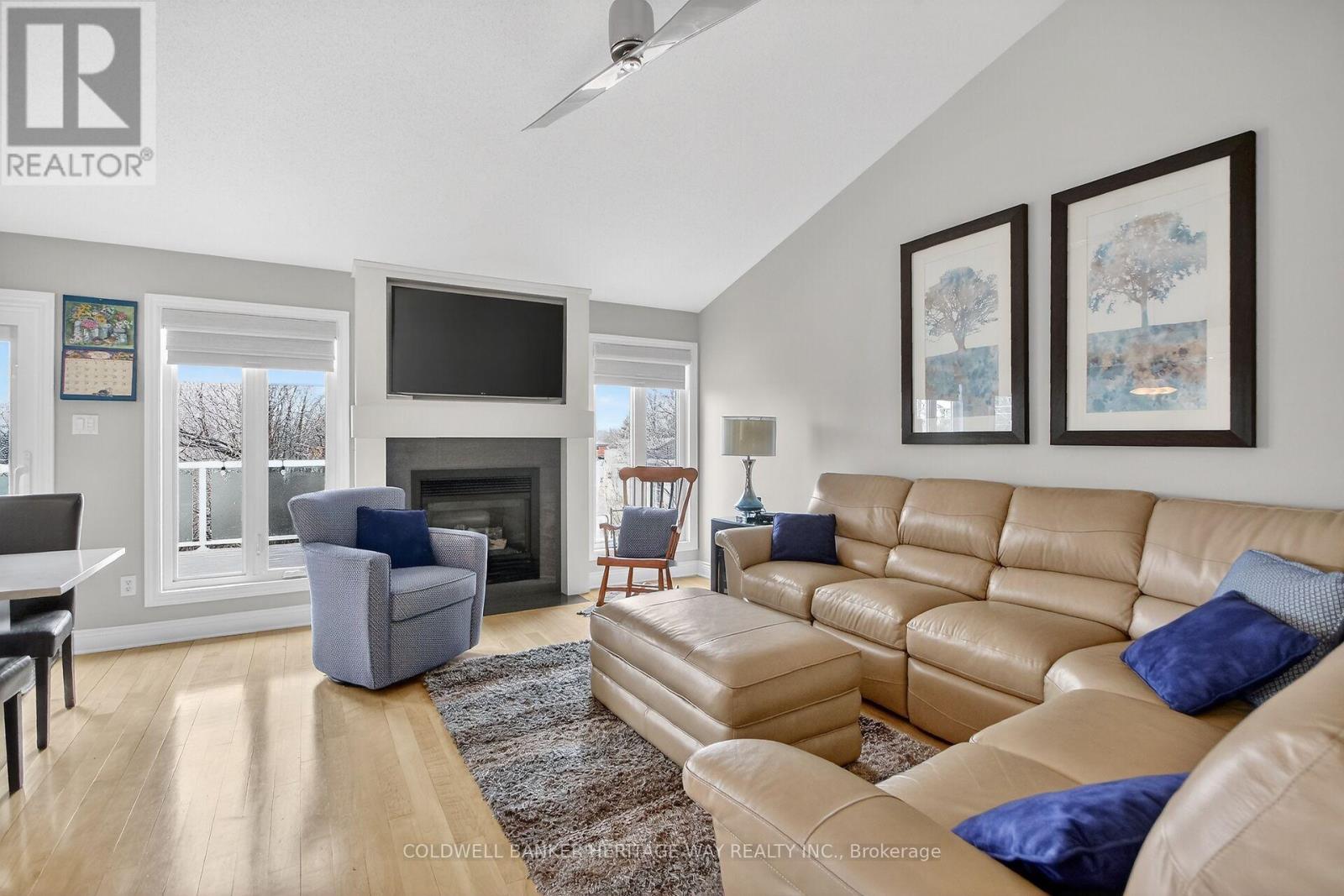 L.R with gas fireplace, mounted T.V