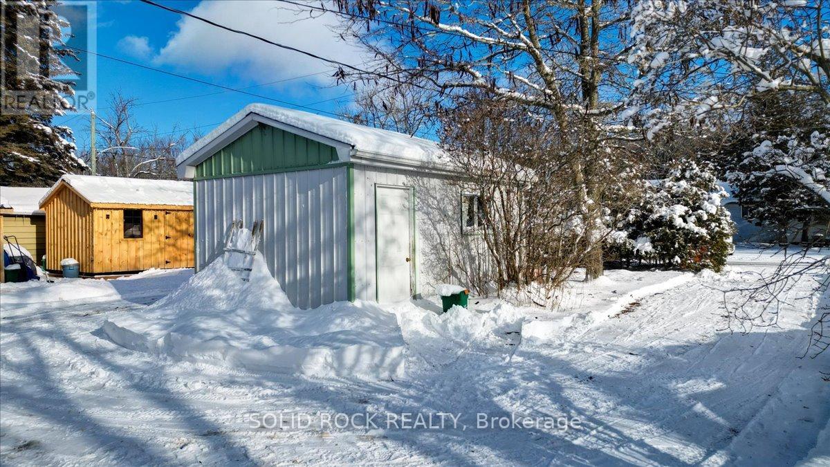 shed in middle of circle driveway