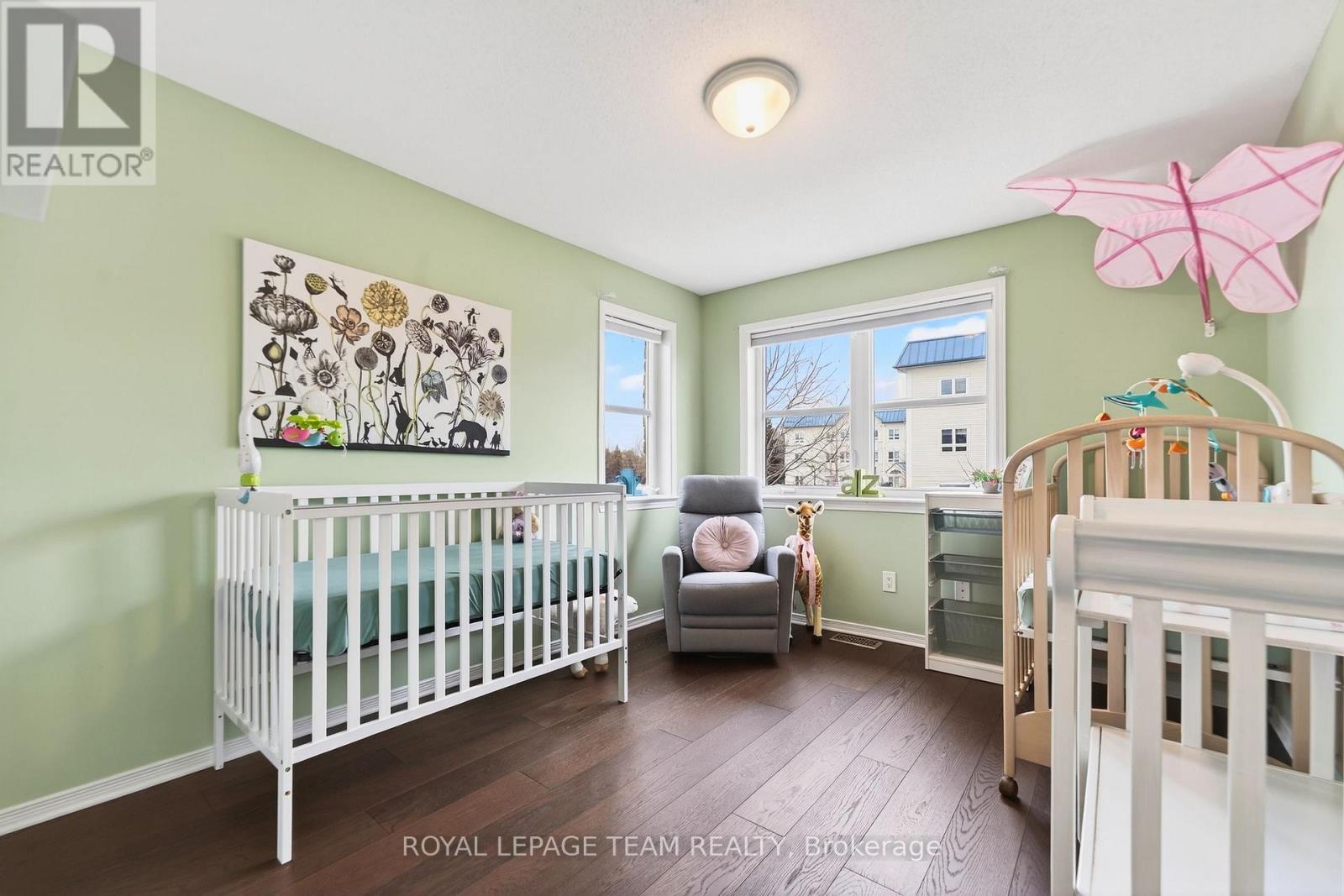 Bright babies room is big enough for twins!