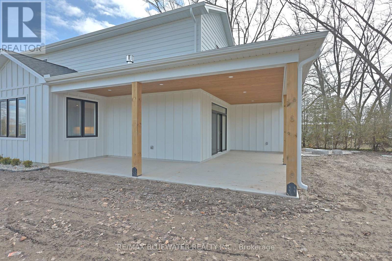 with concrete base, wood ceiling and pot lights