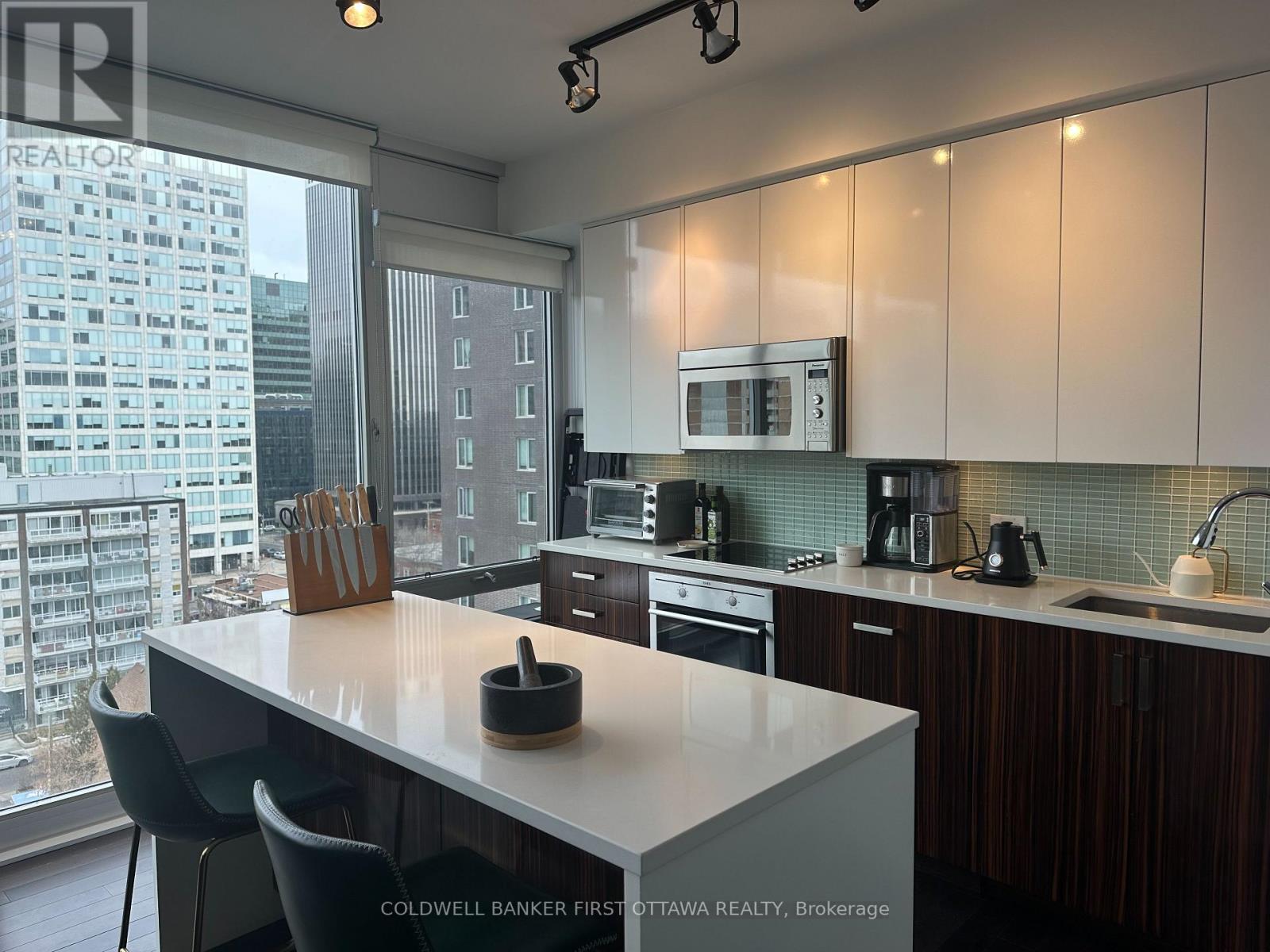 Kitchen features ceiling/floor windows