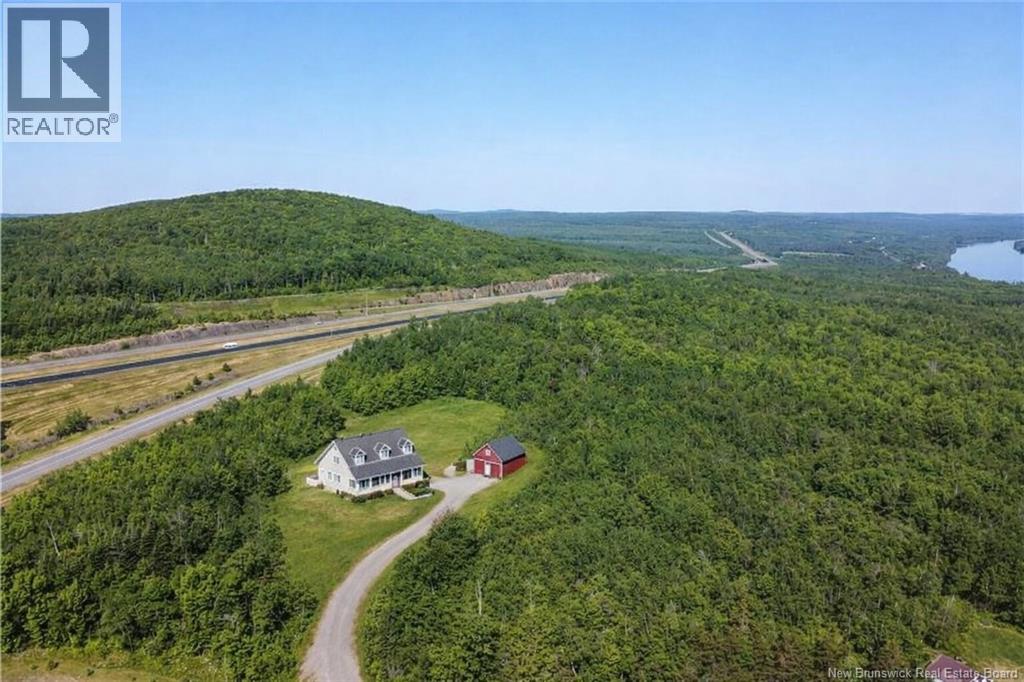 Modified Picture using AI to depict a residence and barn on this 9+ Acres