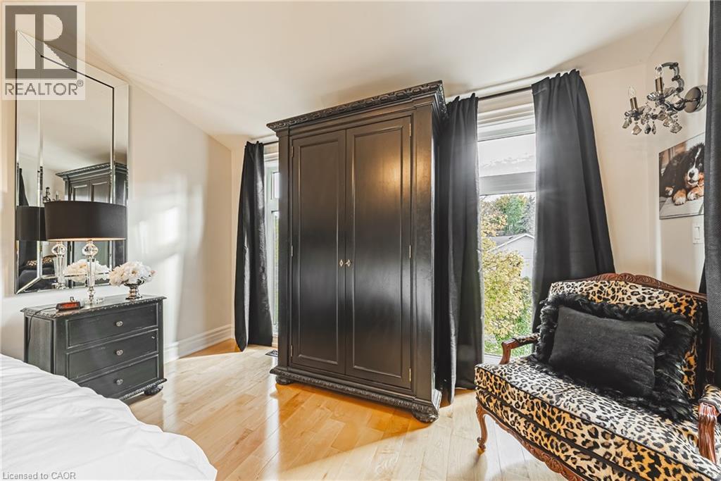Bedroom featuring light wood-type flooring and baseboards