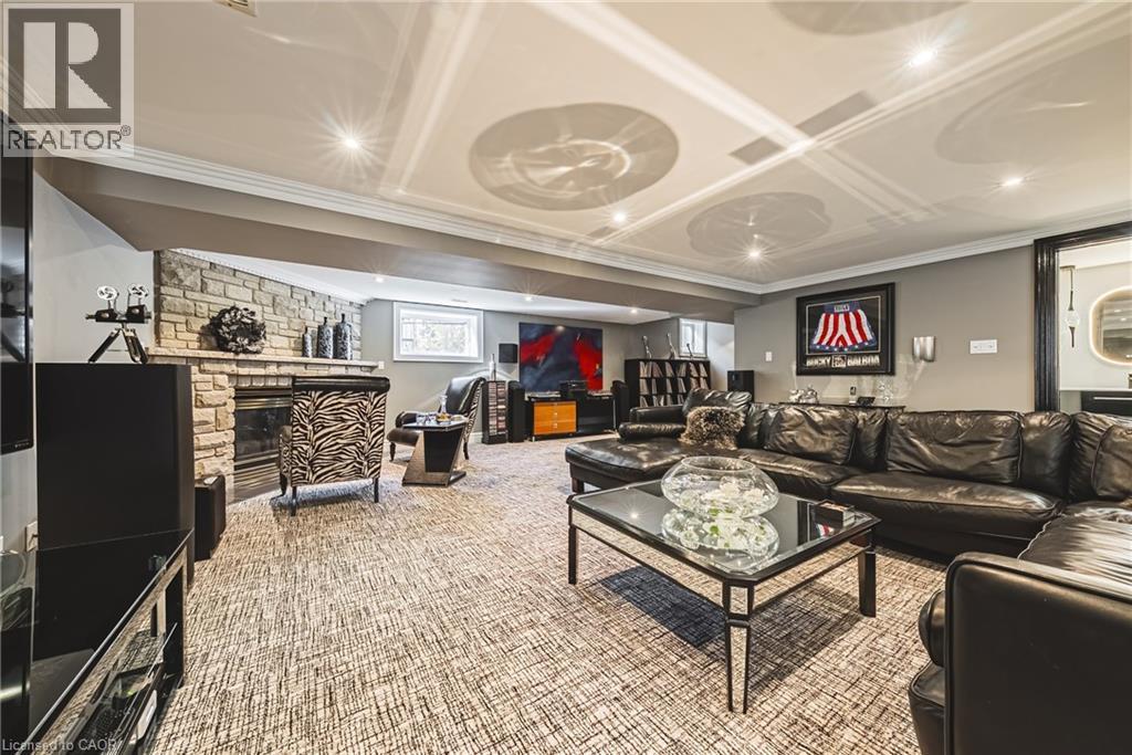 Carpeted living area with crown molding and recessed lighting