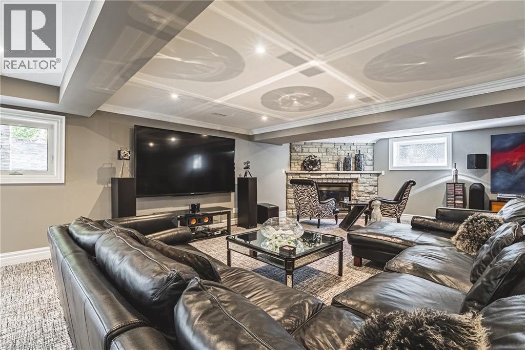 Carpeted living area with baseboards and a fireplace