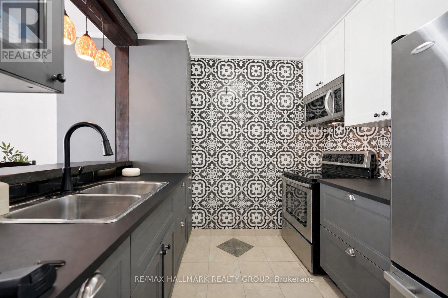 Renovated Kitchen with modern cabinets and tile