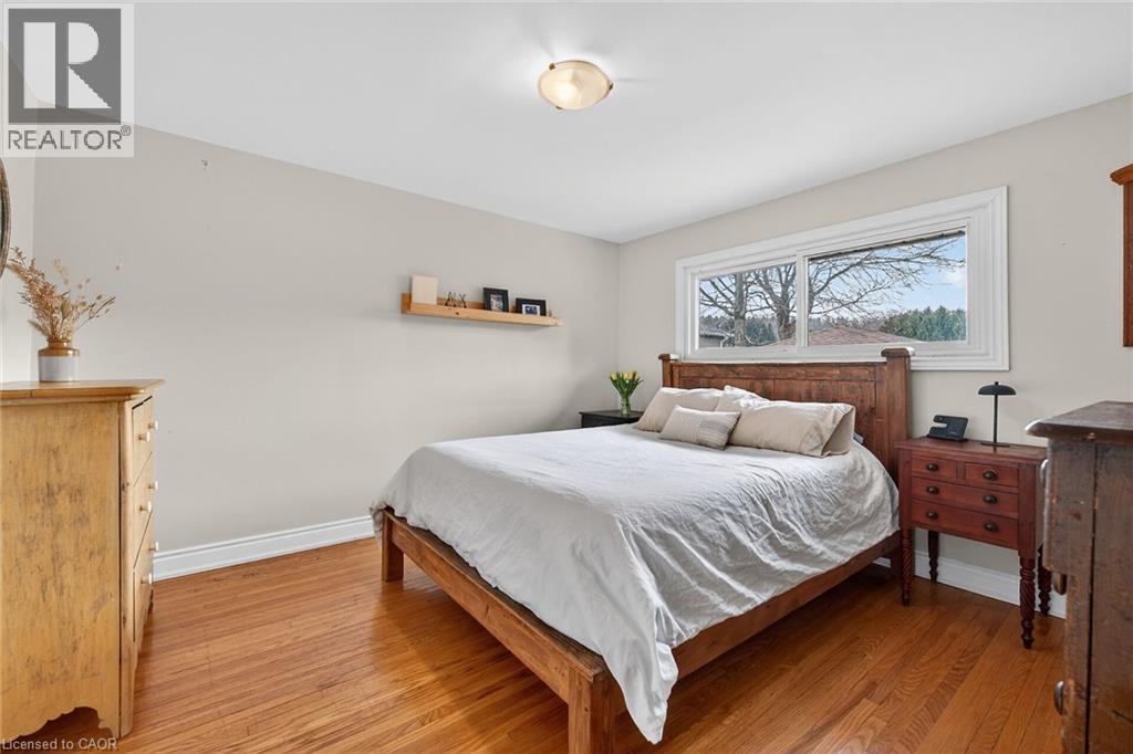 Bedroom featuring baseboards and light wood-type flooring
