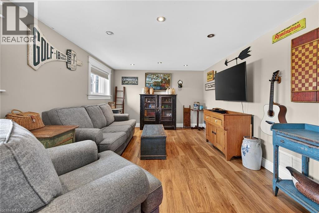 Living room featuring light wood-style floors and recessed lighting