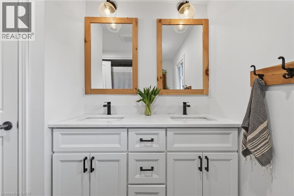 Full bath featuring double vanity