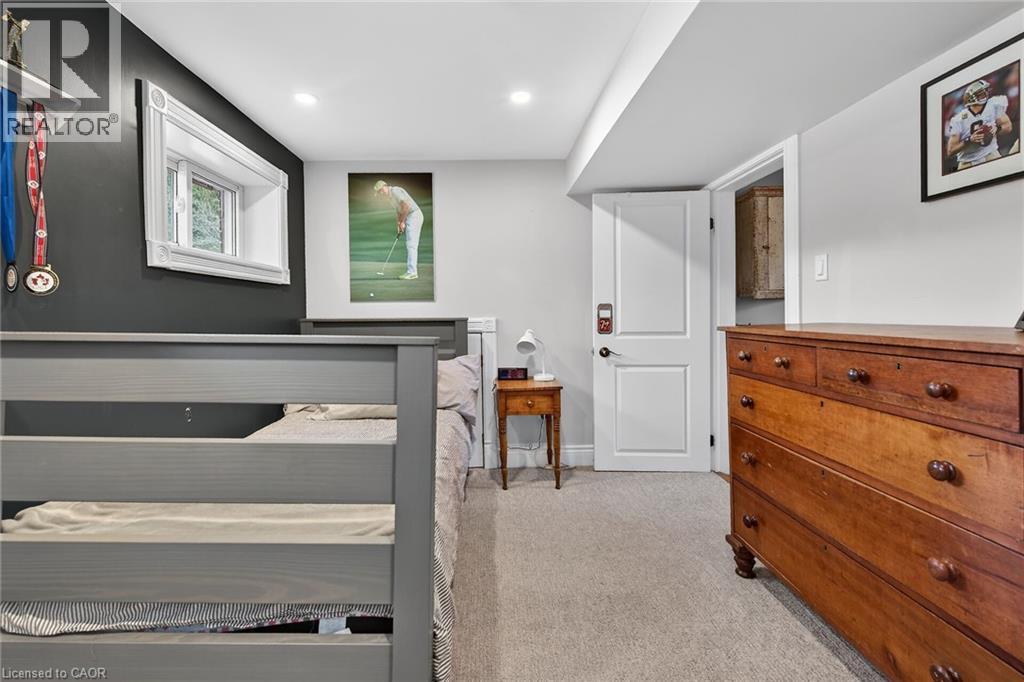 Bedroom featuring light carpet and recessed lighting