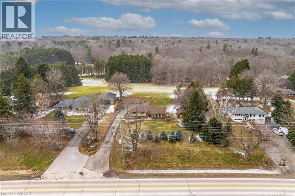 Aerial perspective of suburban area featuring a forest