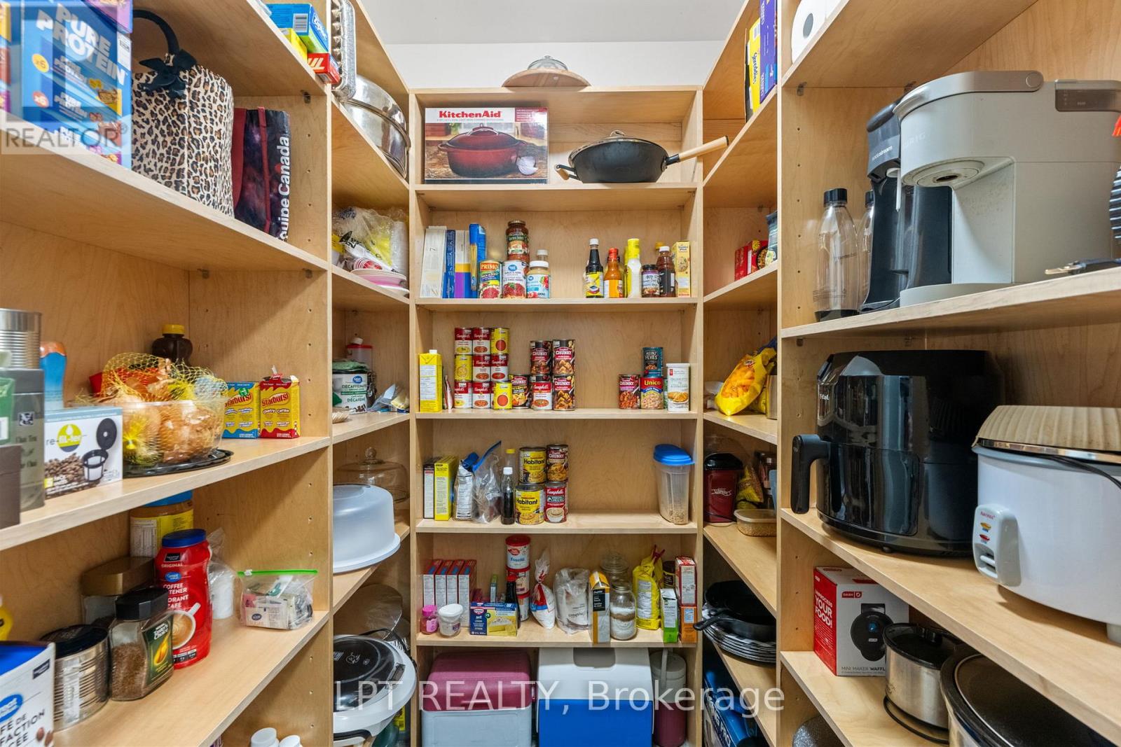 What a nice sized pantry with glass door.
