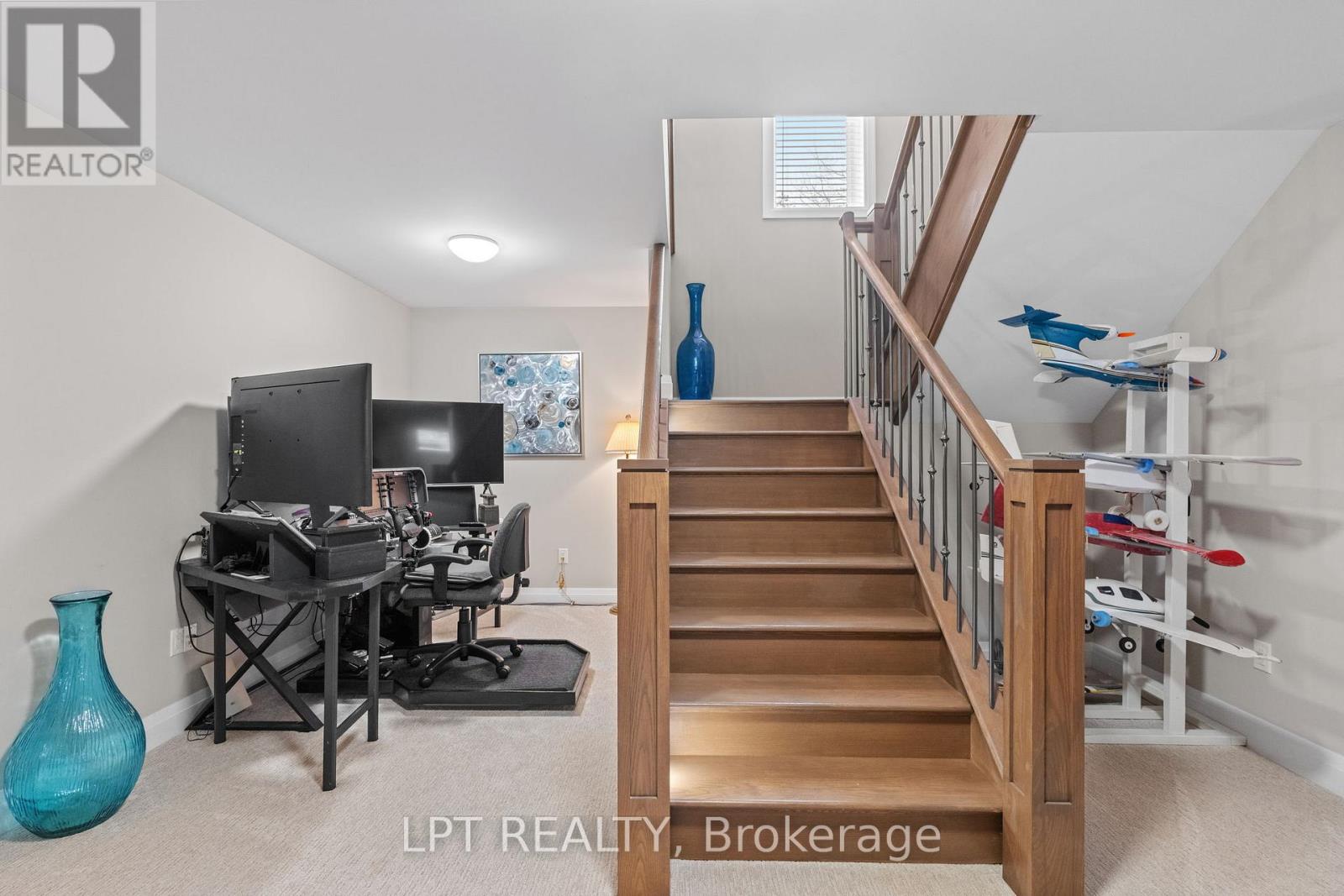Beautiful wood stair case to the lower level.