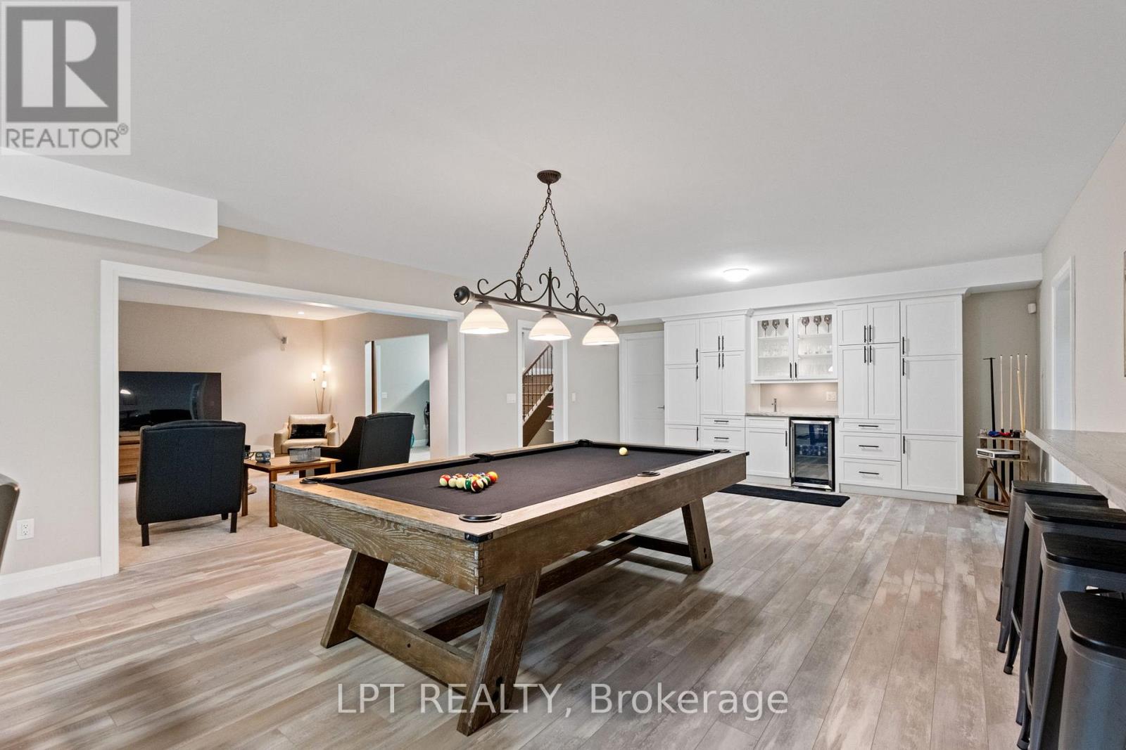 Wet bar and custom made cabinets for storage.