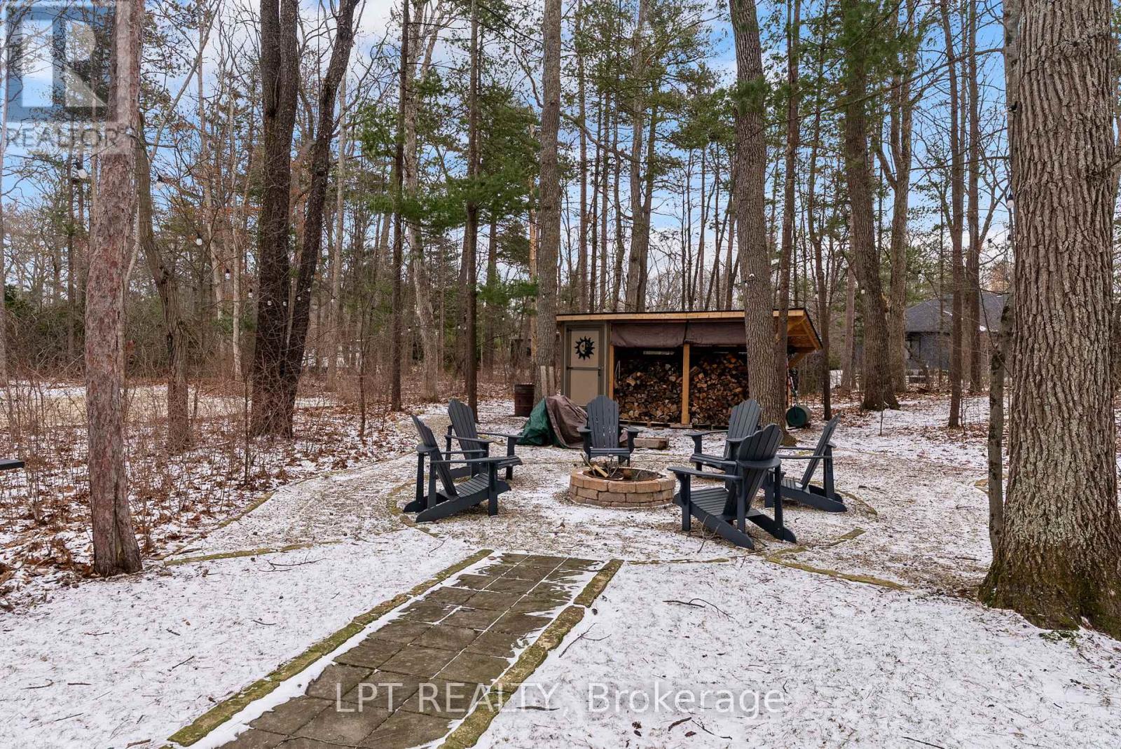 Fire pit area with wood shed to keep a great fire!