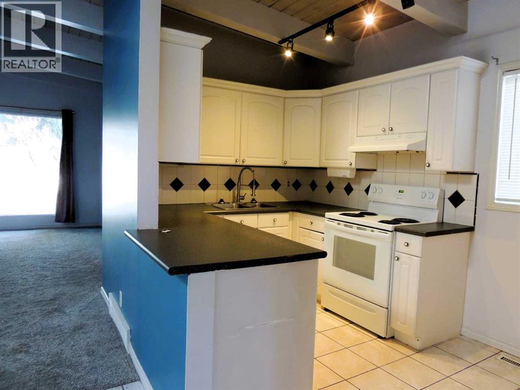 Single Family House Bi-level for Sale in  Canmore Road NW Banff Trail Calgary 