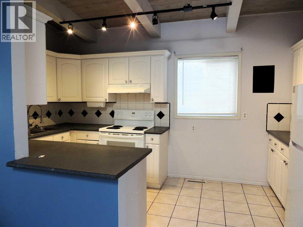 Single Family House Bi-level for Sale in  Canmore Road NW Banff Trail Calgary 