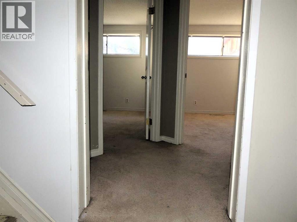 Single Family House Bi-level for Sale in  Canmore Road NW Banff Trail Calgary 