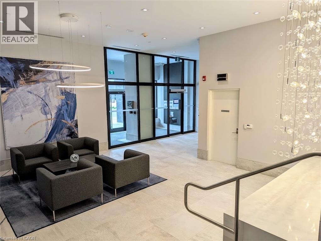 Community lobby with expansive windows and recessed lighting
