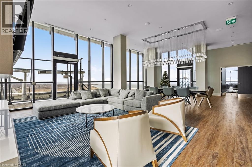 Living area with wood finished floors and a high ceiling