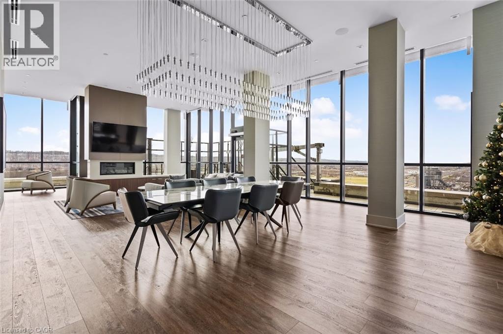 Dining room featuring floor to ceiling windows and dark wood finished floors