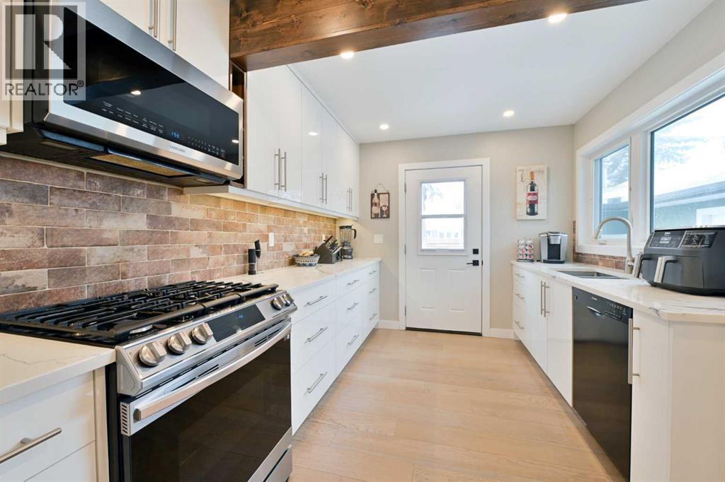 Single Family House Bungalow for Sale in  Lombardy Crescent SW North Glenmore Park Calgary 